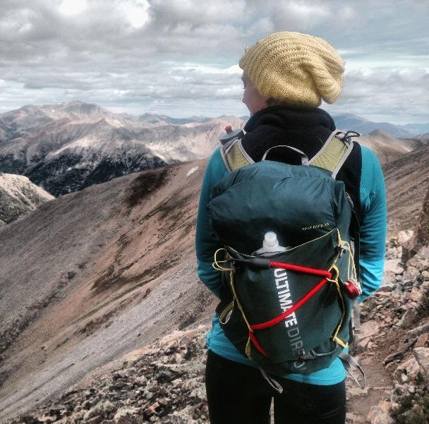 Britt rocking the Fastpack 20 at the top of a 14er along the Nolan's 14 route.