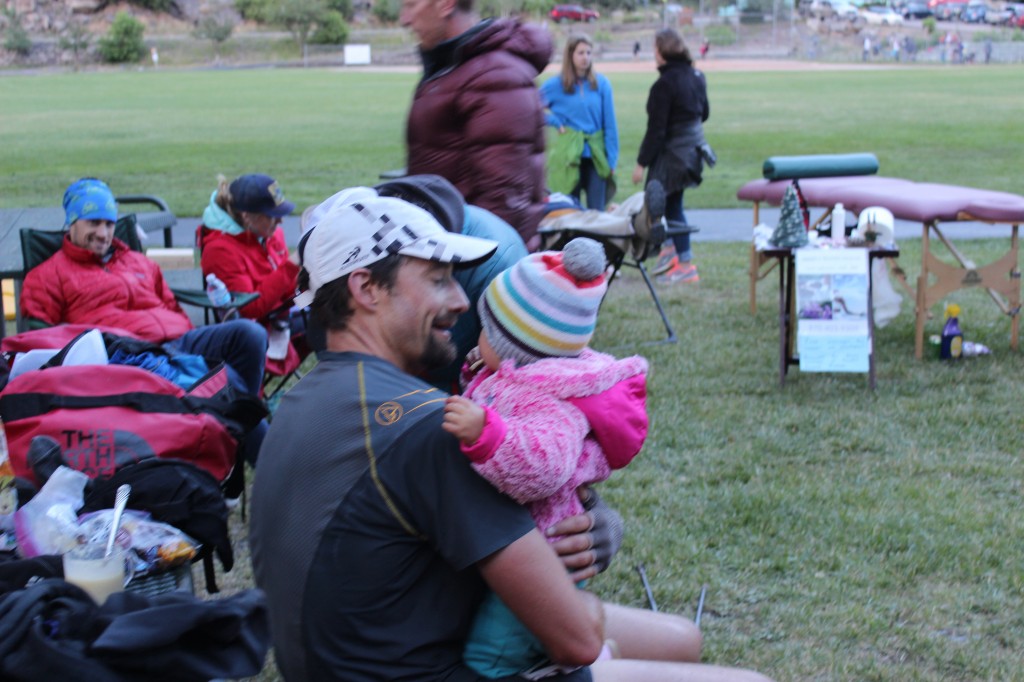 Jared  stops to visit his daughter on his way through the Ouray aid station. 