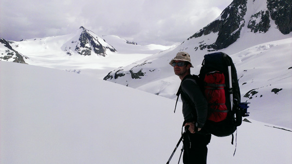 Peter posing after the weather finally cleared and we could see the big glacier in the distance behind.