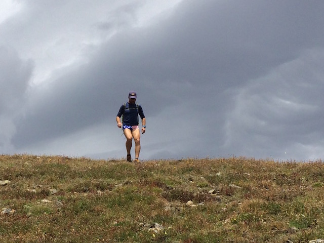 Jed running the grassy ridge on the Continental Divide, leading to Mt. Alice.